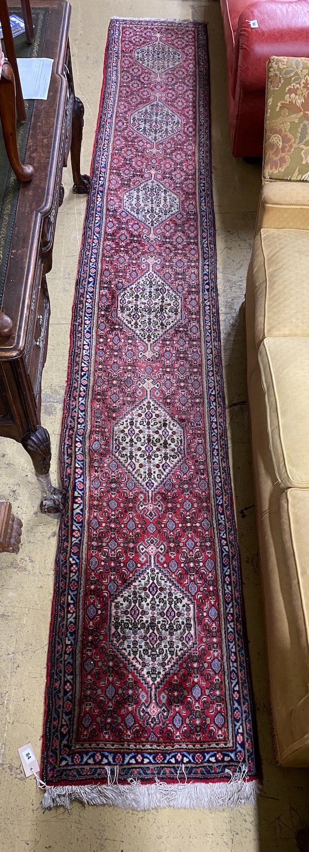A North West Persian red ground runner, 366 x 55cm